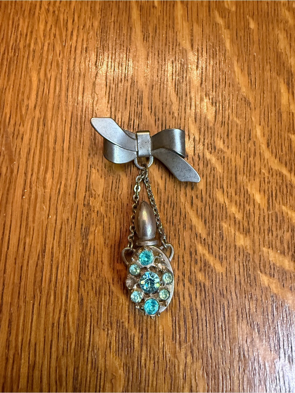 Vintage-Inspired Silver Bow Drop Pin with Aqua Crystal Accents